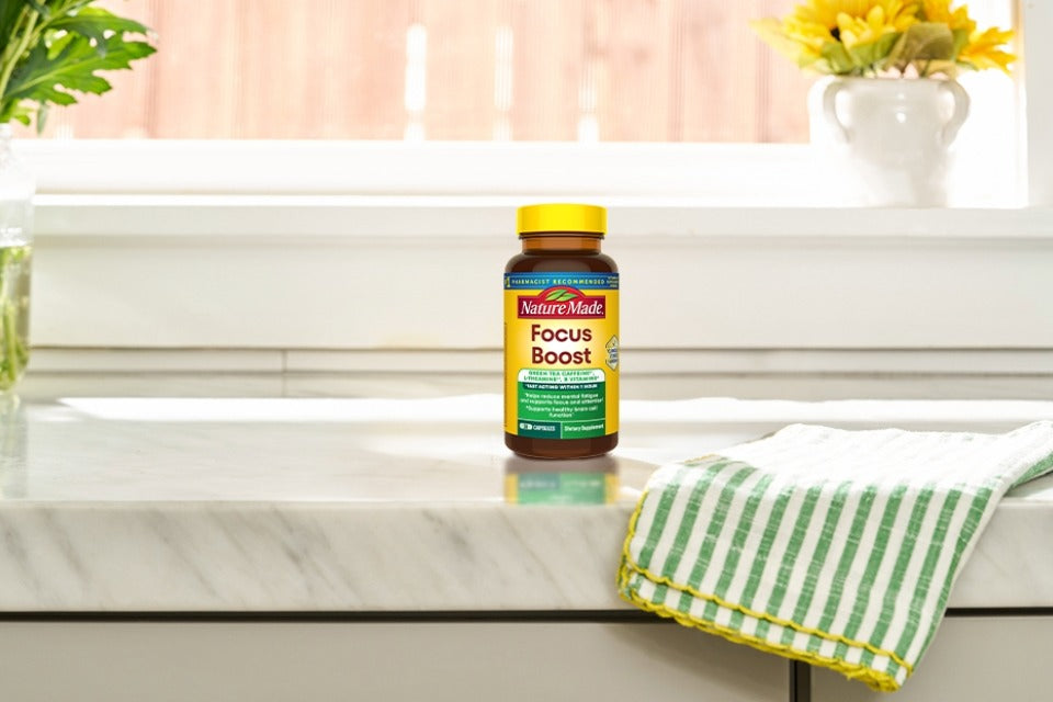 Nature Made Focus Boost Capsules on a kitchen counter.