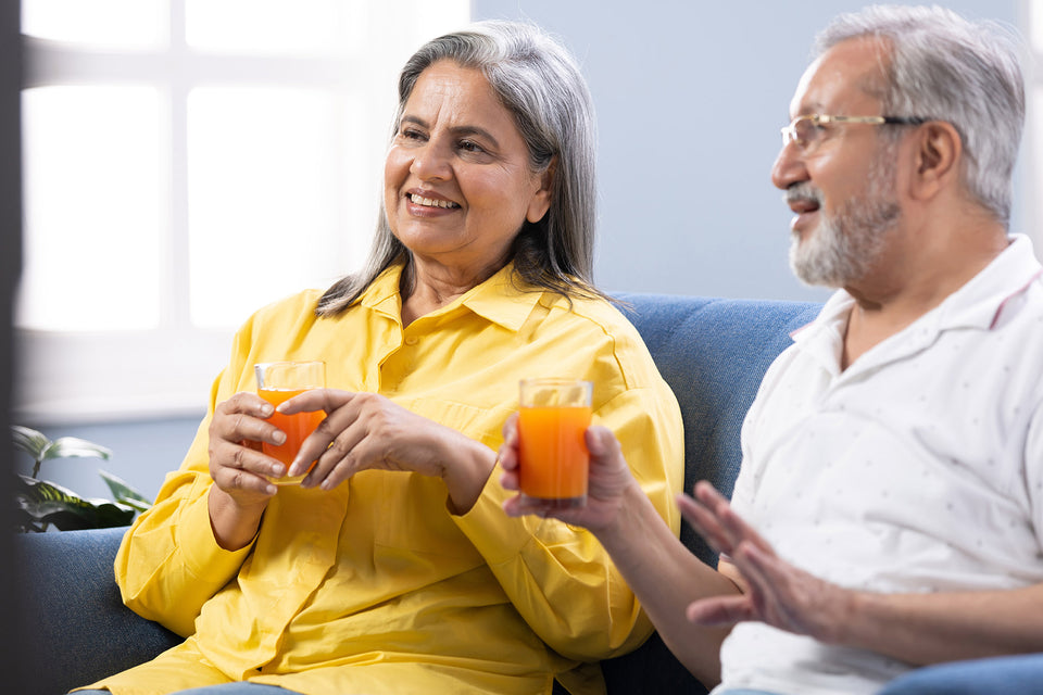 People enjoying orange juice, which contains Vitamin C